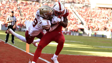RALEIGH, NC - NOVEMBER 03: Kelvin Harmon #3 of the North Carolina State Wolfpack catches a pass for a eight-yard touchdown against Stanford Samuels III #8 of the Florida State Seminoles at Carter-Finley Stadium on November 3, 2018 in Raleigh, North Carolina. (Photo by Lance King/Getty Images)
