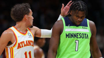 ATLANTA, GEORGIA - JANUARY 19: Trae Young #11 of the Atlanta Hawks walks over to Anthony Edwards #1 of the Minnesota Timberwolves after he was ejected with a double technical foul during the second half at State Farm Arena on January 19, 2022 in Atlanta, Georgia. NOTE TO USER: User expressly acknowledges and agrees that, by downloading and or using this photograph, User is consenting to the terms and conditions of the Getty Images License Agreement. (Photo by Kevin C. Cox/Getty Images)