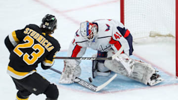 Mar 5, 2021; Boston, Massachusetts, USA; Washington Capitals goalie Vitek Vanecek (41) makes a save against Boston Bruins center Jack Studnicka (23) during the first period at TD Garden. Mandatory Credit: Paul Rutherford-USA TODAY Sports