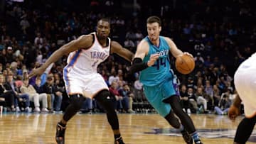 Jan 2, 2016; Charlotte, NC, USA; Charlotte Hornets center Frank Kaminsky (44) drives to the basket against Oklahoma City Thunder forward Serge Ibaka (9) during the second half at Time Warner Cable Arena. The Thunder defeated the Hornets 109-90. Mandatory Credit: Jeremy Brevard-USA TODAY Sports