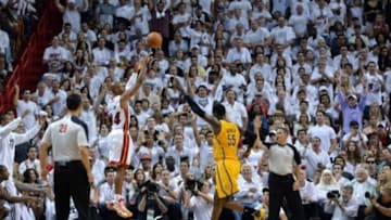May 24, 2014; Miami, FL, USA; Miami Heat guard Ray Allen (34) takes a three point shot over Indiana Pacers center Roy Hibbert (55) in game three of the Eastern Conference Finals of the 2014 NBA Playoffs at American Airlines Arena. Miami Heat defeated the Indiana Pacers 99-87. Mandatory Credit: Steve Mitchell-USA TODAY Sports