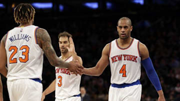 Mar 5, 2016; New York, NY, USA; New York Knicks forward Derrick Williams (23), guard Arron Afflalo (4) and guard Jose Calderon (3) celebrate against the Detroit Pistons during the second half at Madison Square Garden. The Knicks defeated the Pistons 102-89. Mandatory Credit: Adam Hunger-USA TODAY Sports