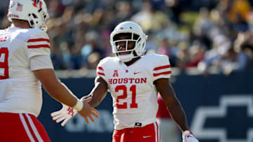 ANNAPOLIS, MD - OCTOBER 20: Patrick Carr #21 of the Houston Cougars celebrates with Will Noble #69 of the Houston Cougars after scoring a touchdown during the first half at Navy-Marines Memorial Stadium on October 20, 2018 in Annapolis, Maryland. (Photo by Will Newton/Getty Images)