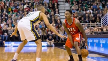 Jan 2, 2015; Salt Lake City, UT, USA; Atlanta Hawks guard Jeff Teague (0) dribbles the ball while being guarded by Utah Jazz guard Dante Exum (11) during the third quarter at EnergySolutions Arena. Atlanta Hawks won the game 98-92. Mandatory Credit: Chris Nicoll-USA TODAY Sports