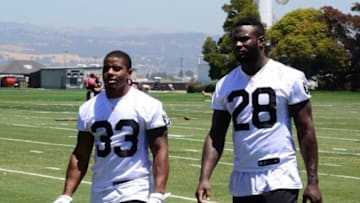 May 31, 2016; Alameda, CA, USA; Oakland Raiders running backs DeAndre Washington (33) and Latavius Murray (28) at organized team activities at the Raiders practice facility. Mandatory Credit: Kirby Lee-USA TODAY Sports