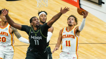 Atlanta Hawks guard Trae Young shoots a layup while Minnesota Timberwolves center Naz Reid. Mandatory Credit: Brace Hemmelgarn-USA TODAY Sports