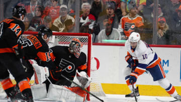 PHILADELPHIA, PA - NOVEMBER 16: Derick Brassard #10 of the New York Islanders attempts a scoring chance against Sean Couturier #14, Matt Niskanen #15, and Brian Elliott #37 of the Philadelphia Flyers on November 16, 2019 at the Wells Fargo Center in Philadelphia, Pennsylvania. (Photo by Len Redkoles/NHLI via Getty Images)