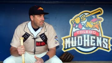 May 30, 2014; Toledo, OH, USA; Toledo Mud Hens (Detroit Tigers affiliate) third baseman Mike Hessman (27) in the dugout prior to the game against the Charlotte Knights at Fifth Third Field. Mandatory Credit: Andrew Weber-USA TODAY Sports