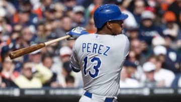Mar 31, 2014; Detroit, MI, USA; Kansas City Royals catcher Salvador Perez (13) hits a single against the Detroit Tigers in the eighth inning of an opening day baseball game at Comerica Park. Detroit won 4-3. Mandatory Credit: Rick Osentoski-USA TODAY Sports