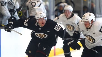 BOSTON - JUNE 28: Casey Dornbach chases a puck, pushing away Samuel Asselin during a scrimmage on Day 3 of a Boston Bruins development camp at Warrior Ice Arena in the Brighton neighborhood of Boston on June 28, 2019. (Photo by John Tlumacki/The Boston Globe via Getty Images)