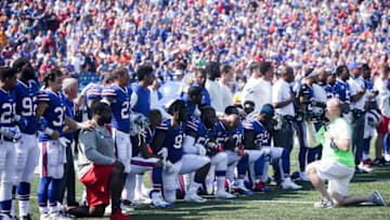 ORCHARD PARK, NY - SEPTEMBER 24: Buffalo Bills players kneel during the American National anthem before an NFL game against the Denver Broncos on September 24, 2017 at New Era Field in Orchard Park, New York. (Photo by Brett Carlsen/Getty Images)
