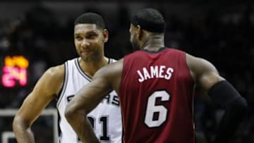 Jun 5, 2014; San Antonio, TX, USA; San Antonio Spurs forward Tim Duncan (21) talks to Miami Heat forward LeBron James (6) during the second quarter in game one of the 2014 NBA Finals at AT&T Center. Mandatory Credit: Soobum Im-USA TODAY Sports