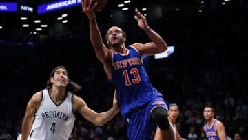 Oct 20, 2016; Brooklyn, NY, USA; New York Knicks center Joakim Noah (13) drives to the basket again Brooklyn Nets forward Luis Scola (4) during first half at Barclays Center. Mandatory Credit: Noah K. Murray-USA TODAY Sports