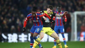 LONDON, ENGLAND - JANUARY 21: Wilfried Zaha of Crystal Palace is tackled by Pierre-Emile Hojbjerg of Southampton during the Premier League match between Crystal Palace and Southampton FC at Selhurst Park on January 21, 2020 in London, United Kingdom. (Photo by Bryn Lennon/Getty Images)