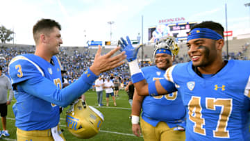 PASADENA, CALIFORNIA - NOVEMBER 17: Wilton Speight #3 of the UCLA Bruins celebrates with Shea Pitts #47 after a 34-27 UCLA win over the USC Trojans at Rose Bowl on November 17, 2018 in Pasadena, California. (Photo by Harry How/Getty Images)