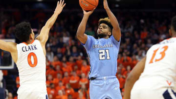 CHARLOTTESVILLE, VA - NOVEMBER 16: Mike Smith #21 of the Columbia Lions shoots over Kihei Clark #0 of the Virginia Cavaliers in the first half during a game at John Paul Jones Arena on November 16, 2019 in Charlottesville, Virginia. (Photo by Ryan M. Kelly/Getty Images)