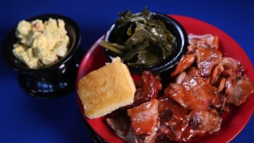 Darnell Ashley’s Q Restaurant on King Drive serves many of the same items sold at Ashley's on Center, such as pork shoulder, which is sliced, not pulled. Here it's served with cornbread, collard greens and potato salad.Blackbbq Ashleyspork