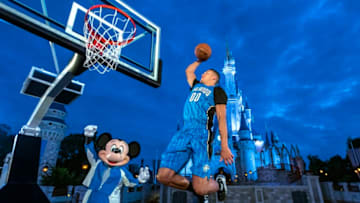 Aaron Gordon shows off the Orlando Magic's new jerseys with a new patch for Disney on it. Photo by Matt Stroshane/Walt Disney World