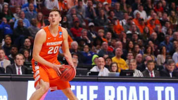 Mar 27, 2016; Chicago, IL, USA; Syracuse Orange forward Tyler Lydon (20) shoots the ball after losing his shoe against the Virginia Cavaliers during the first half in the championship game of the midwest regional of the NCAA Tournament at the United Center. Mandatory Credit: Dennis Wierzbicki-USA TODAY Sports