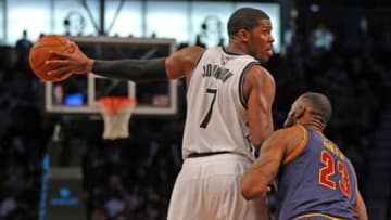 Mar 27, 2015; Brooklyn, NY, USA; Cleveland Cavaliers forward LeBron James (23) defends Brooklyn Nets forward Joe Johnson (7) during the second half at Barclays Center. The Nets defeated the Cavaliers 106 - 98. Mandatory Credit: Adam Hunger-USA TODAY Sports