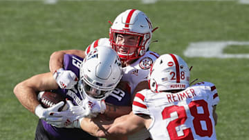 EVANSTON, ILLINOIS - NOVEMBER 07: Riley Lees #19 of the Northwestern Wildcats is tackled by JoJo Domann #13 and Luke Reimer #28 of the Nebraska Cornhuskers at Ryan Field on November 07, 2020 in Evanston, Illinois. (Photo by Jonathan Daniel/Getty Images)