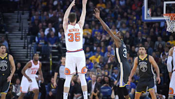 OAKLAND, CA - FEBRUARY 12: Dragan Bender #35 of the Phoenix Suns shoots over Kevin Durant #35 of the Golden State Warriors during an NBA basketball game at ORACLE Arena on February 12, 2018 in Oakland, California. NOTE TO USER: User expressly acknowledges and agrees that, by downloading and or using this photograph, User is consenting to the terms and conditions of the Getty Images License Agreement. (Photo by Thearon W. Henderson/Getty Images)