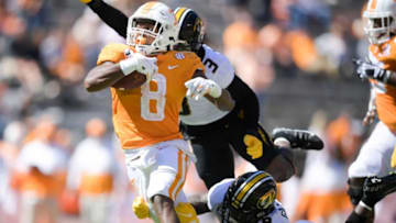 Tennessee running back Ty Chandler (8) runs the ball as Missouri safety Martez Manuel (3) and Missouri safety Tyree Gillespie (9) defend in the second quarter during a game between Tennessee and Missouri at Neyland Stadium in Knoxville, Tenn. on Saturday, Oct. 3, 2020.100320 Tenn Mo Jpg