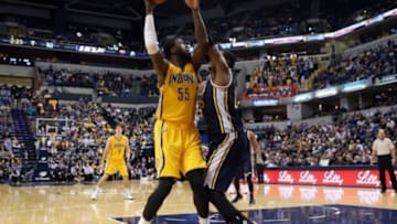 Nov 10, 2014; Indianapolis, IN, USA; Indiana Pacers center Roy Hibbert (55) takes a shot against Utah Jazz forward Derrick Favors (15) at Bankers Life Fieldhouse. Indiana defeats Utah 97-86. Mandatory Credit: Brian Spurlock-USA TODAY Sports