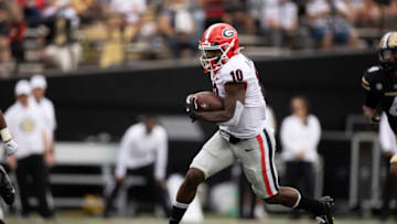 NASHVILLE, TN - SEPTEMBER 25: Kearis Jackson #10 of the Georgia Bulldogs runs with the ball for a first down against the Vanderbilt Commodores during the first quarter at Vanderbilt Stadium on September 25, 2021 in Nashville, Tennessee. (Photo by Brett Carlsen/Getty Images)