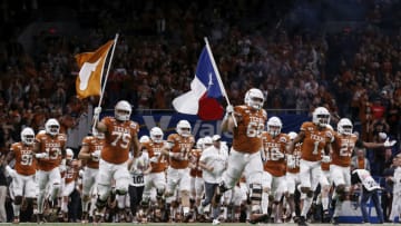 SAN ANTONIO, TX - DECEMBER 31: The Texas Longhorns take the field during the Valero Alamo Bowl against the Utah Utes at the Alamodome on December 31, 2019 in San Antonio, Texas. (Photo by Tim Warner/Getty Images)