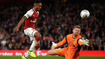 LONDON, ENGLAND - SEPTEMBER 20: Theo Walcott of Arsenal scores his sides first goal past Ian Lawlor of Doncaster Rovers during the Carabao Cup Third Round match between Arsenal and Doncaster Rovers at Emirates Stadium on September 20, 2017 in London, England. (Photo by Mike Hewitt/Getty Images)