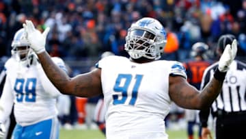 CHICAGO, IL - NOVEMBER 19: A'Shawn Robinson #91 of the Detroit Lions celebrates after defeating the Chicago Bears 27-24 at Soldier Field on November 19, 2017 in Chicago, Illinois. (Photo by Joe Robbins/Getty Images)