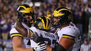 EVANSTON, IL - SEPTEMBER 29: Karan Higdon #22 of the Michigan Wolverines celebrates his game winning touchdown against the Northwestern Wildcats with Ben Mason #42 (L) and Jon Runyan #75 at Ryan Field on September 29, 2018 in Evanston, Illinois. Michigan defeated Northwestern 20-17. (Photo by Jonathan Daniel/Getty Images)
