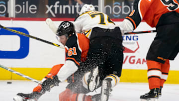Apr 10, 2021; Philadelphia, Pennsylvania, USA; Boston Bruins left wing Jake DeBrusk (74) collides with Philadelphia Flyers defenseman Justin Braun (61) in the first period at the Wells Fargo Center. Mandatory Credit: Mitchell Leff-USA TODAY Sports