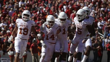 DALLAS, TX - OCTOBER 08: Dylan Haines #14 of the Texas Longhorns celebrates a pass interception against the Oklahoma Sooners at Cotton Bowl on October 8, 2016 in Dallas, Texas. (Photo by Ronald Martinez/Getty Images)
