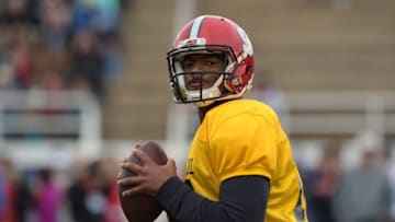 Jan 26, 2016; Fairhope, AL, USA; South squad quarterback Jacoby Brissett of North Carolina State (12) drops back to pass during Senior Bowl practice at Fairhope Stadium. Mandatory Credit: Glenn Andrews-USA TODAY Sports