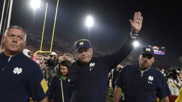 LOS ANGELES, CA - NOVEMBER 24: Head coach Brian Kelly of the Notre Dame Fighting Irish waves as he walks off the field at Los Angeles Memorial Coliseum after defeating the USC Trojans on November 24, 2018 in Los Angeles, California. (Photo by Kevork Djansezian/Getty Images)