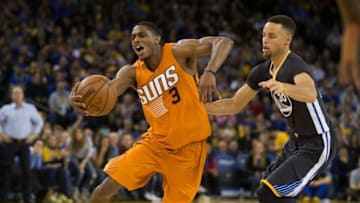 Mar 12, 2016; Oakland, CA, USA; Phoenix Suns guard Brandon Knight (3) drives in ahead of Golden State Warriors guard Stephen Curry (30) during the fourth quarter at Oracle Arena. The Warriors defeated the Suns 123-116. Mandatory Credit: Kelley L Cox-USA TODAY Sports