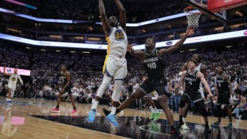 SACRAMENTO, CALIFORNIA - APRIL 15: Draymond Green #23 of the Golden State Warriors grabs a rebound over Harrison Barnes #40 of the Sacramento Kings during the fourth quarter of Game One of the Western Conference First Round Playoffs at the Golden 1 Center on April 15, 2023 in Sacramento, California. NOTE TO USER: User expressly acknowledges and agrees that, by downloading and or using this photograph, User is consenting to the terms and conditions of the Getty Images License Agreement. (Photo by Loren Elliott/Getty Images)