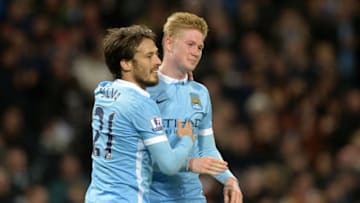 Manchester City's Belgian midfielder Kevin De Bruyne (R) celebrates with Manchester City's Spanish midfielder David Silva after scoring their fourth goal during the English Premier League football match between Manchester City and Sunderland at The Etihad stadium in Manchester, north west England on December 26, 2015. AFP PHOTO / OLI SCARFFRESTRICTED TO EDITORIAL USE. No use with unauthorized audio, video, data, fixture lists, club/league logos or 'live' services. Online in-match use limited to 75 images, no video emulation. No use in betting, games or single club/league/player publications. / AFP / OLI SCARFF (Photo credit should read OLI SCARFF/AFP/Getty Images)