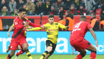LEVERKUSEN, GERMANY - DECEMBER 02: Benjamin Henrichs of Leverkusen, Christian Pulisic of Dortmund and Jonathan Tah of Leverkusen battle for the ball during the Bundesliga match between Bayer 04 Leverkusen and Borussia Dortmund at BayArena on December 2, 2017 in Leverkusen, Germany. (Photo by TF-Images/TF-Images via Getty Images)