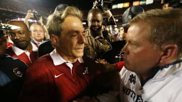 MIAMI GARDENS, FL - JANUARY 07: Head coach Nick Saban (L) of the Alabama Crimson Tide and head coach Jim Kelly of the Notre Dame Fighting Irish shake hands after the 2013 Discover BCS National Championship game at Sun Life Stadium on January 7, 2013 in Miami Gardens, Florida. Alabama won the game by a score of 42-14. (Photo by Streeter Lecka/Getty Images)