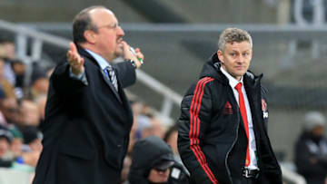 Manchester United's Norwegian caretaker manager Ole Gunnar Solskjaer (R) looks to Newcastle United's Spanish manager Rafael Benitez as he reacts during the English Premier League football match between Newcastle United and Manchester United at St James' Park in Newcastle-upon-Tyne, north east England on January 2, 2019. (Photo by Lindsey PARNABY / AFP) / RESTRICTED TO EDITORIAL USE. No use with unauthorized audio, video, data, fixture lists, club/league logos or 'live' services. Online in-match use limited to 120 images. An additional 40 images may be used in extra time. No video emulation. Social media in-match use limited to 120 images. An additional 40 images may be used in extra time. No use in betting publications, games or single club/league/player publications. / (Photo credit should read LINDSEY PARNABY/AFP via Getty Images)