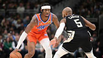 Nov 5, 2022; OKC Thunder guard Shai Gilgeous-Alexander (2) dribbles the ball up the court against Bucks guard Jevon Carter : Michael McLoone-USA TODAY Sports