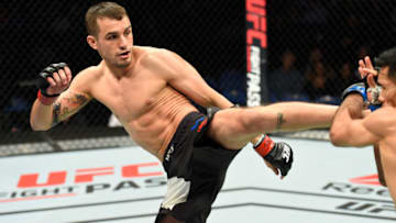 BUFFALO, NY - APRIL 08: Miles Jury lands a kick on Mike De La Torre in their featherweight bout during the UFC 210 event at KeyBank Center on April 8, 2017 in Buffalo, New York. (Photo by Josh Hedges/Zuffa LLC/Zuffa LLC via Getty Images)