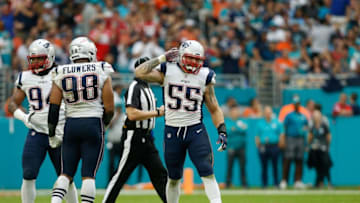 MIAMI, FL - DECEMBER 09: John Simon #55 of the New England Patriots celebrates sacking Ryan Tannehill #17 of the Miami Dolphins in the fourth quarter at Hard Rock Stadium on December 9, 2018 in Miami, Florida. (Photo by Michael Reaves/Getty Images)