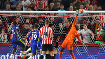 BRENTFORD, ENGLAND - OCTOBER 16: Edouard Mendy of Chelsea makes a save during the Premier League match between Brentford and Chelsea at Brentford Community Stadium on October 16, 2021 in Brentford, England. (Photo by Catherine Ivill/Getty Images)