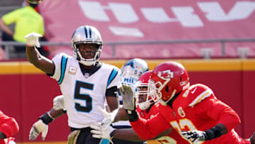 Nov 8, 2020; Kansas City, Missouri, USA; Carolina Panthers quarterback Teddy Bridgewater (5) throws a pass against Kansas City Chiefs defensive end Tanoh Kpassagnon (92) during the first half at Arrowhead Stadium. Mandatory Credit: Denny Medley-USA TODAY Sports