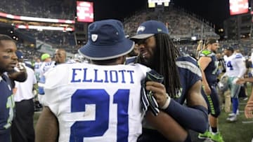 Aug 25, 2016; Seattle, WA, USA; Dallas Cowboys running back Ezekiel Elliott (21) and Seattle Seahawks cornerback Richard Sherman (25) embrace after a NFL football game at CenturyLink Field. The Seahawks defeated the Cowboys 27-17. Mandatory Credit: Kirby Lee-USA TODAY Sports