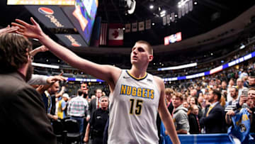 DENVER, CO - APRIL 9: Nikola Jokic (15) of the Denver Nuggets high fives fans as he walks off the court after the second half of the Nuggets' 88-82 win over the Portland Trail Blazers on Monday, April 9, 2018. (Photo by AAron Ontiveroz/The Denver Post via Getty Images)